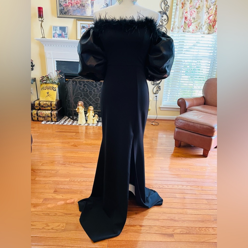 Size 2 strapless black gown w feather trim top and removable bubble sleeves